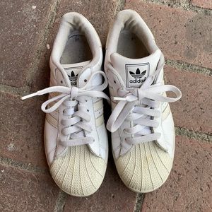 White on white Adidas shell toe sneakers